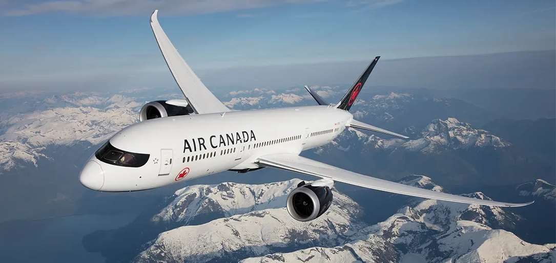 Air Canada flying over mountains