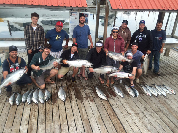 Campbell River Fishing Guide with fishermen holdin their catch of the day