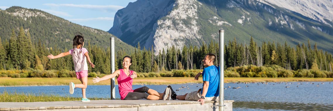 Family sitting on dock